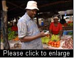 Market spy Stanley Mchome sends text messages with vital market information that will help other farmers decide when, where and to whom they should sell their products. (Photo: IFAD/M. Millinga)